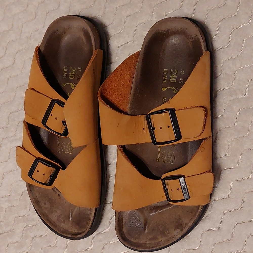 Burnt orange leather Betula sandals by Birkenstock.